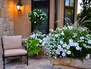 A cozy outdoor room that is beautiful day or evening